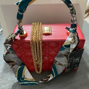 Elegant Red Quilted Handbag with Scarf Accent and Gold tone chain